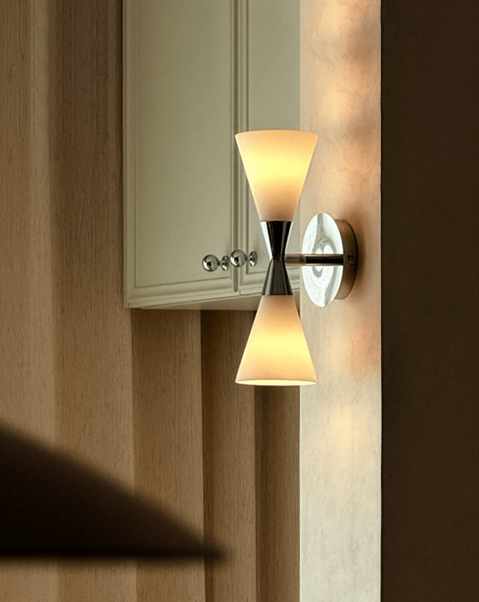 Calden Double Cone Glass Wall Sconce — finish, form and room detail 11