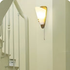 Trevane Triangular Tassel Wall Sconce — finish, form and room detail 4